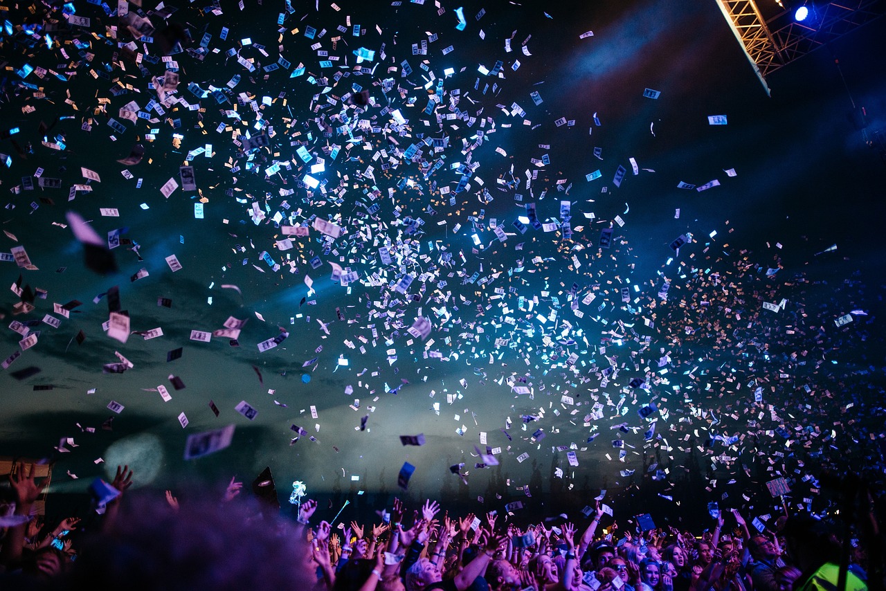 Confetti falling over a concert crowd