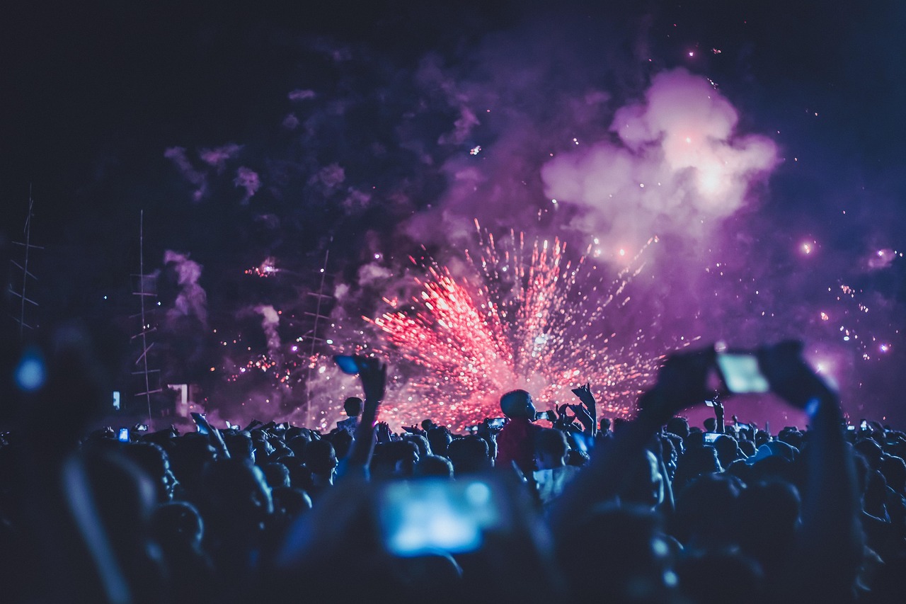 Fireworks over a night festival crowd